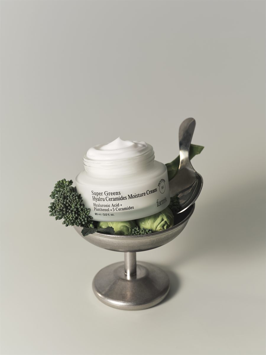Moisture cream still life in a silver coupe